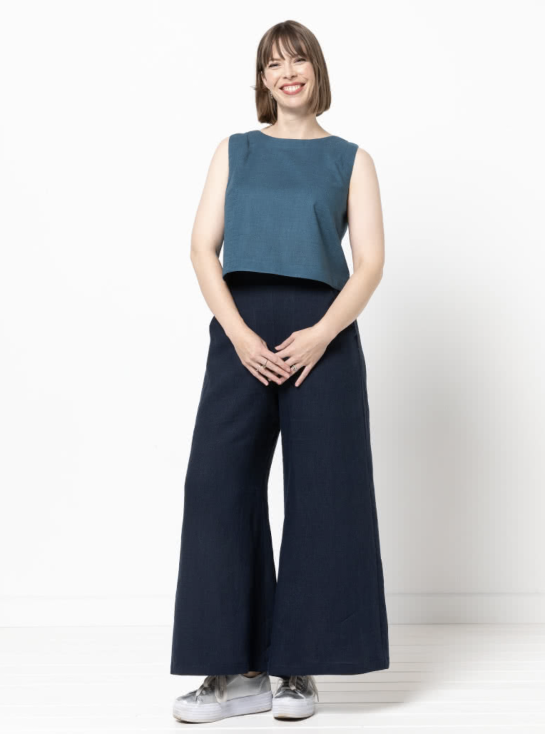 Woman wearing the Loddon Woven Pant sewing pattern from Style Arc on The Fold Line. A trouser pattern made in washed linen, crepe, viscose or fine wool fabrics, featuring a pull-on style, wide legs, angled pockets, flat front waistband elasticated at side