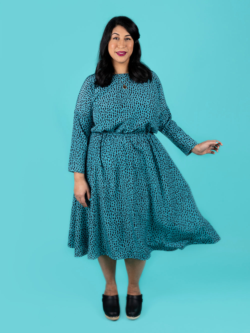 Woman wearing the Lotta Dress sewing pattern from Tilly and the Buttons on The Fold Line. A dress pattern made in chambray, viscose (rayon), Tencel (lyocell), double gauze, brushed cotton or crêpe fabrics, featuring a blousey bodice, flared skirt, elastic