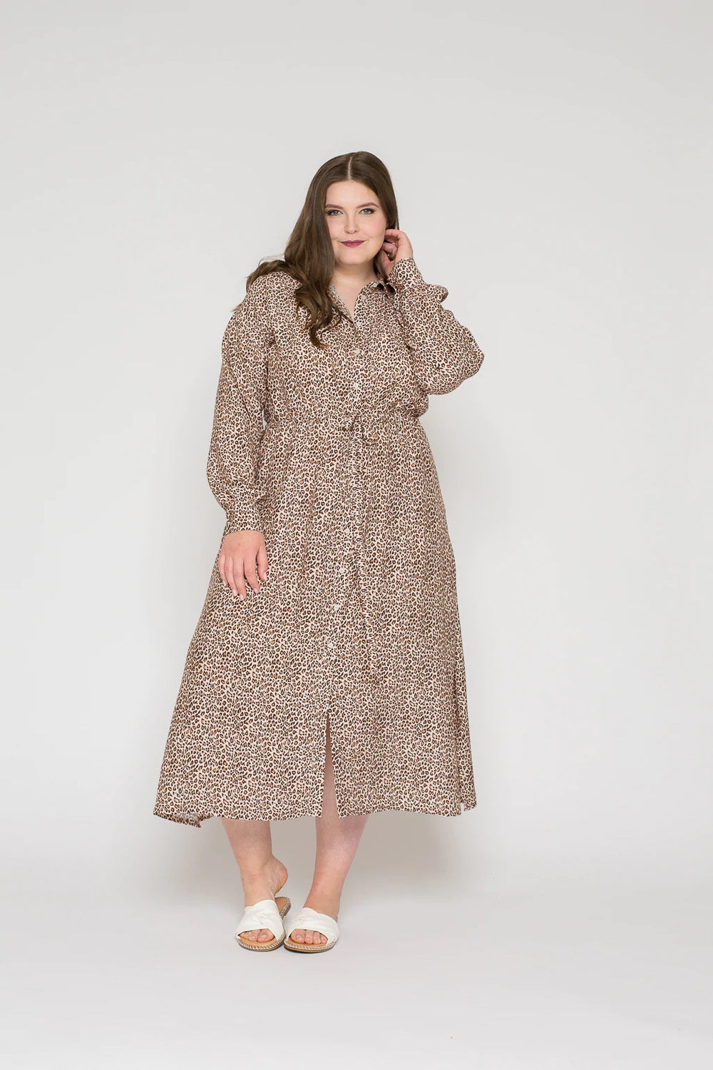 Woman wearing the Lou Shirt Dress sewing pattern from Bara Studio on The Fold Line. A shirt dress pattern made in viscose, cotton, linen or tencel fabrics, featuring a classic shirt collar, button placket, drawstring waist, extra-long sleeves with elastic