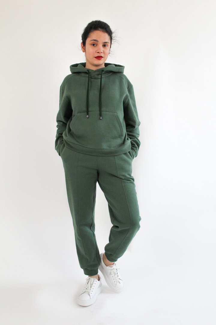 Woman wearing the Luna Joggers sewing pattern from Bella Loves Patterns on The Fold Line. A joggers pattern made in sweatshirting, French terry, Ponte Roma and double knits with cross-wise stretch, featuring a high waist, straight leg, in-seam side pocket