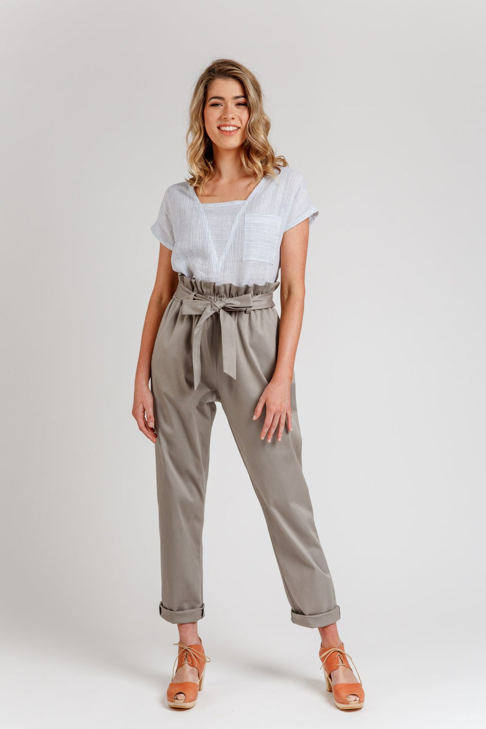 Woman wearing the Opal Pants sewing pattern from Megan Nielsen on The Fold Line. A trouser pattern made in linen, tencel, rayon, poplin, viscose, satin, charmeuse, crepe, wool, and chambray fabrics, featuring a relaxed fit, paperbag waist, inseam pockets,