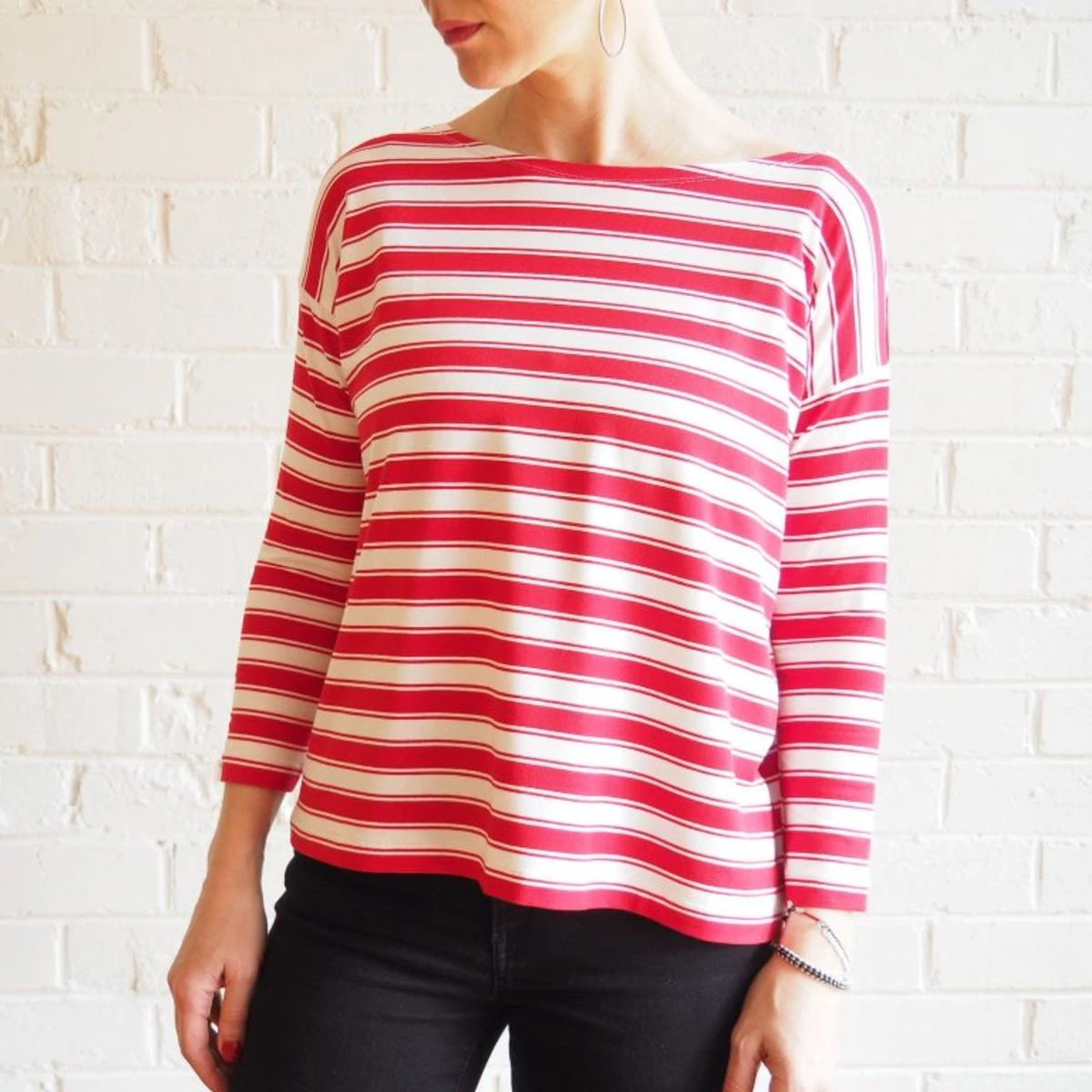 Woman wearing the Mandy Boat Tee sewing pattern from Tessuti Fabrics on The Fold Line. A t-shirt pattern made in two-way stretch cotton, wool or viscose jerseys or knits with elastane, lycra or spandex content fabrics, featuring a wide boxy style, drop sh