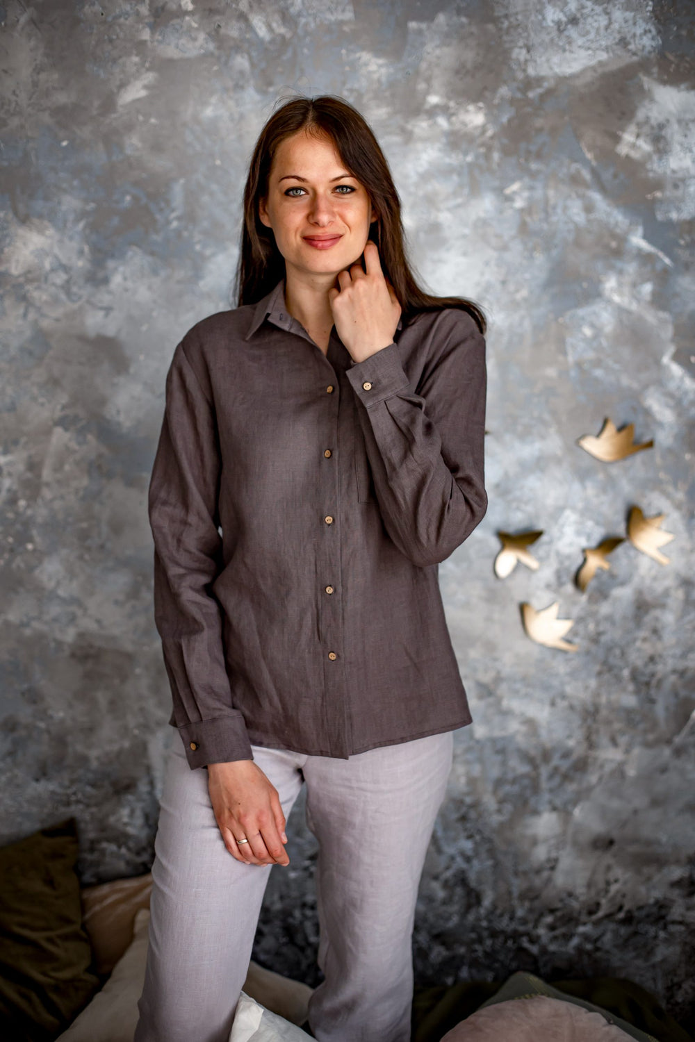 Woman wearing the Marlene Shirt sewing pattern from Kates Sewing Patterns on The Fold Line. A shirt pattern made in cotton or linen fabrics, featuring a straight style, back yoke, classic shirt collar, patch chest pocket, full length sleeves with cuffs an
