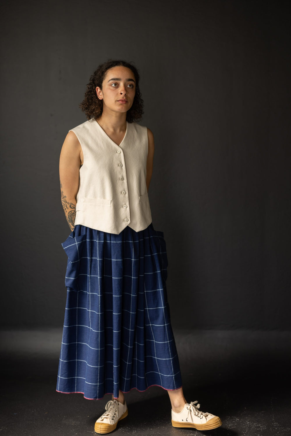 Woman wearing the Mathilde Skirt sewing pattern from Merchant & Mills on The Fold Line. A skirt pattern made in linen, brushed cotton, cotton lawn, cotton poplin, tencel, Indian handlooms, lightweight baby cord or cotton double gauze fabrics, featuring a 