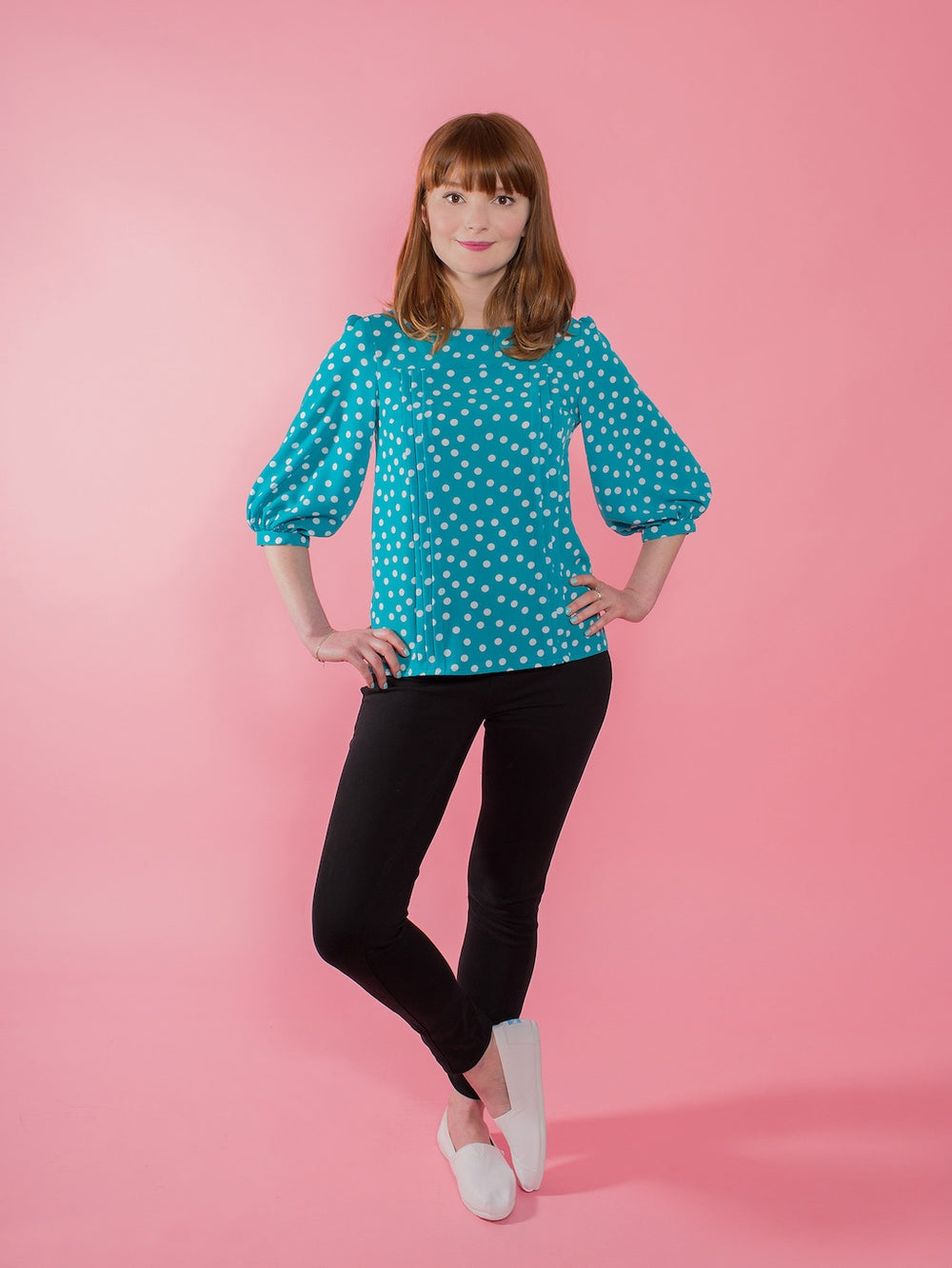Woman wearing the Mathilde Blouse sewing pattern from Tilly and the Buttons on The Fold Line. A blouse pattern made in lightweight cotton, silk, polyester, lawn, voile, viscose (rayon), crêpe de chine, habotai, or charmeuse fabric, featuring tucks down th