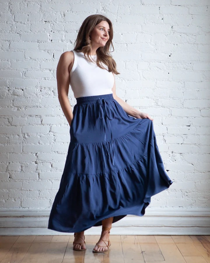 Woman wearing the Mave Skirt sewing pattern from True Bias on The Fold Line. A skirt pattern made in rayon challis, crepe, linen, cotton lawn, voile, silk, chiffon or georgette fabrics, featuring an elastic waist, self-fabric waist tie, in-seam pockets, t