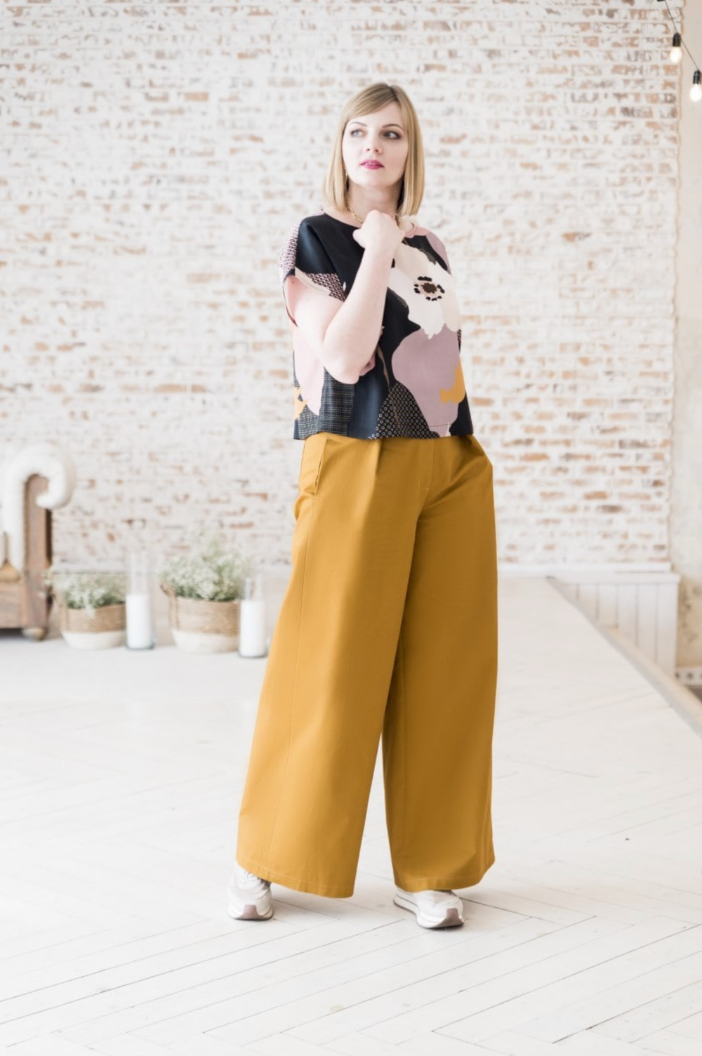 Woman wearing the Max Trousers sewing pattern from Lenaline Patterns on The Fold Line. A trouser pattern made in wool suiting, velvet, corduroy, linen, denim, chambray, cotton twill, chino, tartan or gabardine fabrics, featuring very wide legs, high waist