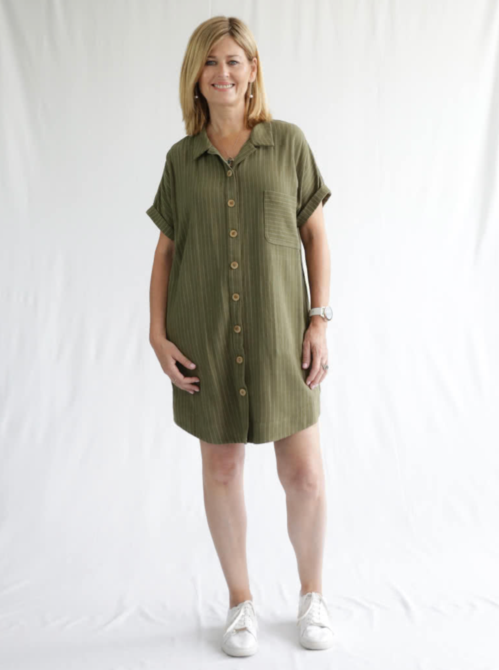 Woman wearing the Max Tunic Dress sewing pattern from Style Arc on The Fold Line. A tunic dress pattern made in linen, crepe, rayon or cotton fabrics, featuring a button front closure, collar, dropped shoulders, back yoke, in-seam pockets, chest patch poc