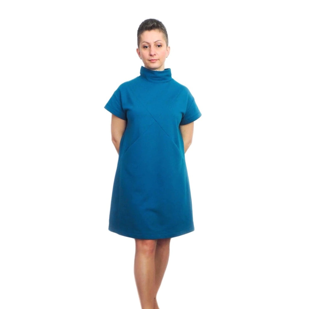 Women wearing the Maxine Dress sewing pattern from Dhurata Davies Patterns on The Fold Line. A dress pattern made in medium to heavy weight stretch fabrics, featuring a loose fit, criss-cross front detail, above knee length hem, pockets, drop shoulder, sh
