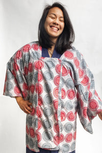 Woman wearing the 143 Japanese Michiyuki sewing pattern from Folkwear on The Fold Line. A robe/jacket pattern made in rayon or silk crepe fabrics, featuring a ¾ length, low, square neckline, double-breasted front opening, robe-style sleeves, narrow neck b