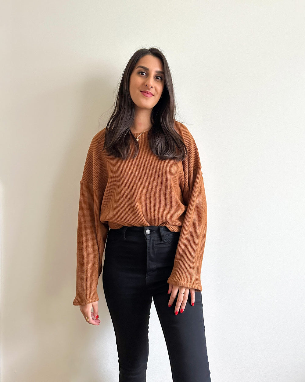 Woman wearing the Mila Jumper sewing pattern from Tammy Handmade on The Fold Line. A jumper pattern made in jersey, ribbed knit, fleece, sweatshirt, knit wool blends or jacquard knit fabrics, featuring dolman dropped full length sleeves, slip-on, slouchy 