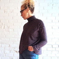 Women wearing the Monroe Turtleneck sewing pattern from Tessuti Fabrics on The Fold Line. A jumper pattern made in stretch cotton, wool jersey, viscose jersey and knit fabrics, featuring a boxy style, drop shoulders, full length fitted sleeves and high ne