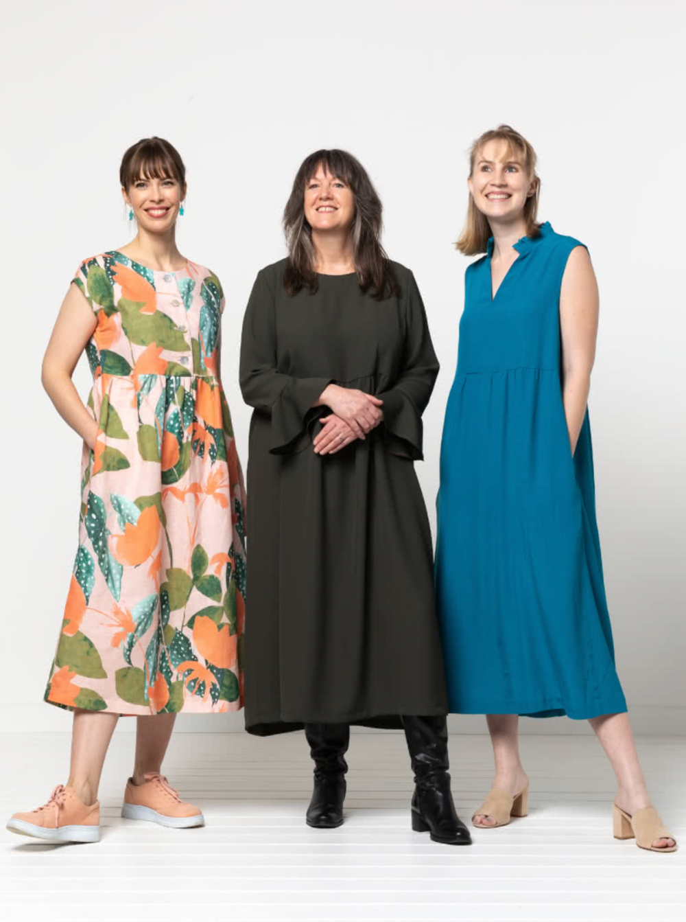 Women wearing the Montana Dress sewing pattern from Style Arc on The Fold Line. A dress pattern made in washed linen, cotton, crepe, or rayon fabrics, featuring pattern pieces to add sleeveless, ¾ or elbow length sleeves, and boat, V-neck or frilled stand