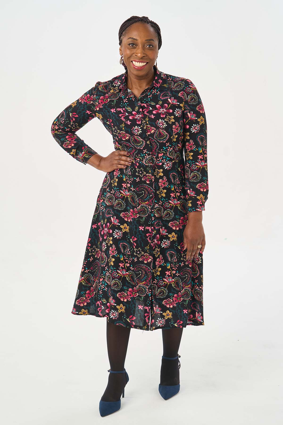 Woman wearing the It Nicole Dress sewing pattern from Sew Over It on The Fold Line. A shirt dress pattern made in cotton poplin, cotton lawn, crepe, viscose or tencel fabrics, featuring a buttoned front, collar and collar stand, midi A-line skirt with gen