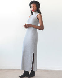 Woman wearing the Nikko Dress sewing pattern by True Bias. A dress pattern made in rib knit, sweater knit, bamboo knit or stretch velvet fabric featuring a mock turtleneck, sleeveless but cut to resemble a racerback, but with enough coverage to wear a reg