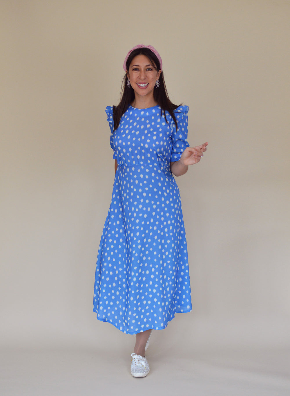 Woman wearing the Park Lane Dress sewing pattern from Nina Lee on The Fold Line. A dress pattern made in viscose/rayon, crepe or silk fabrics, featuring waistline gathers, keyhole opening with button and rouleau loop closure at the back neck, elbow length