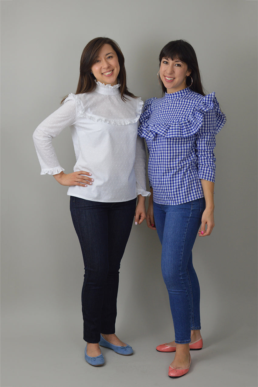 Women wearing the Bloomsbury Blouse sewing pattern from Nina Lee on The Fold Line. A blouse pattern made in cotton lawn, velvet or dupion silk fabrics, featuring a high collar, yoked bodice with broad or narrow ruffles, button-back fastening, bracelet-len
