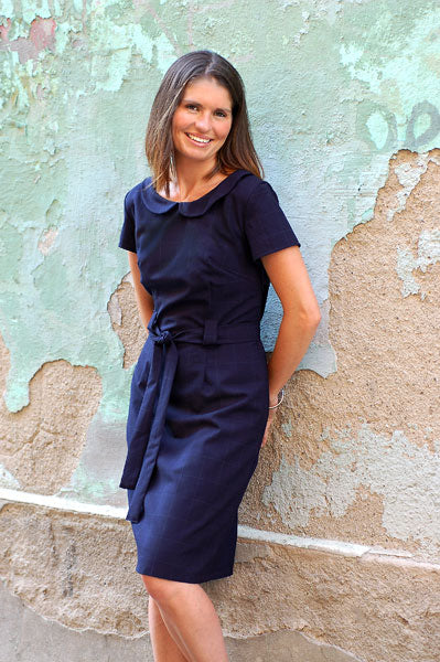 Woman wearing the Bistro Dress sewing pattern from Liesl + Co on The Fold Line. A sheath dress pattern made in cotton sateen, chambray, twill, canvas, denim, duck, linen, and light- to medium-weight wool fabrics, featuring a semi-fit, sash and belt loops,