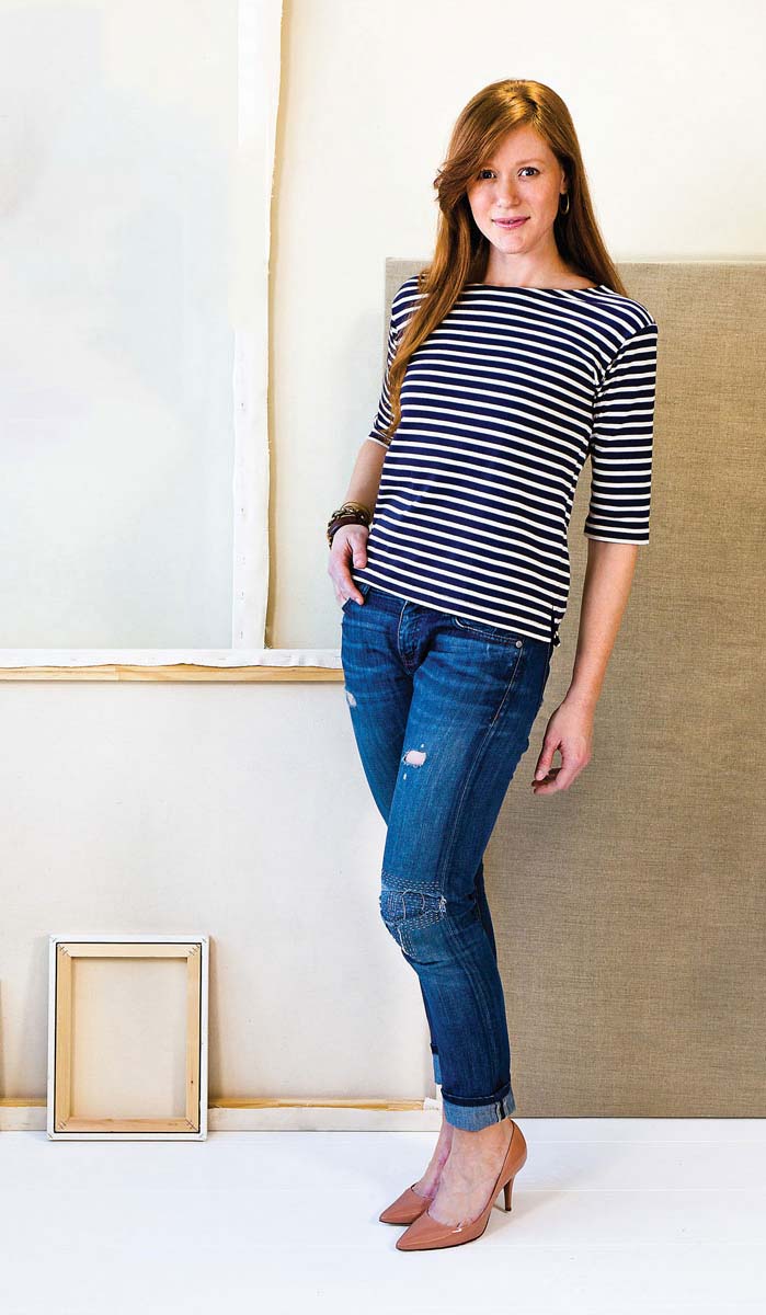 Woman wearing the Maritime Knit Top sewing pattern from Liesl + Co on The Fold Line. A knit top pattern made in jersey, double knit, thermal knit, and interlock fabrics, featuring a pull-on style, three-quarter-length sleeves, bateau neck with topstitchin