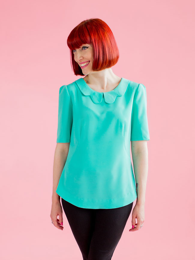 Woman wearing the Orla Shift Top sewing pattern from Tilly and the Buttons on The Fold Line. A blouse pattern made in viscose (rayon), cotton lawn, voile, dotted Swiss, silk or polyester crêpe de chine, or crêpe back satin fabric, featuring curved French 