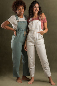 Women wearing the Partner Overalls sewing pattern from Ready to Sew on The Fold Line. A dungarees pattern made in denim, twill, canvas, gabardine, moleskin or linen fabrics, featuring additional extras such as curved inset pockets, faux fly, slimmer leg w