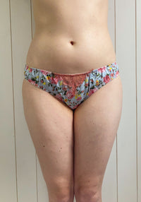 Woman wearing the Penny Knicker sewing pattern from Sew Projects on The Fold Line. A briefs pattern made in cotton, cotton lawn, rigid lace, satin or crepe fabrics, featuring a ruffle style that sits on the hips with medium back coverage and medium rise l