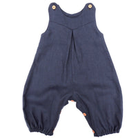 Image showing the Babies' Penny Romper sewing pattern from Dhurata Davies Patterns on The Fold Line. A romper pattern made in light to medium weight woven fabrics, featuring snap fasteners on the shoulders and leg inseam, front V shaped yoke, inverted fro