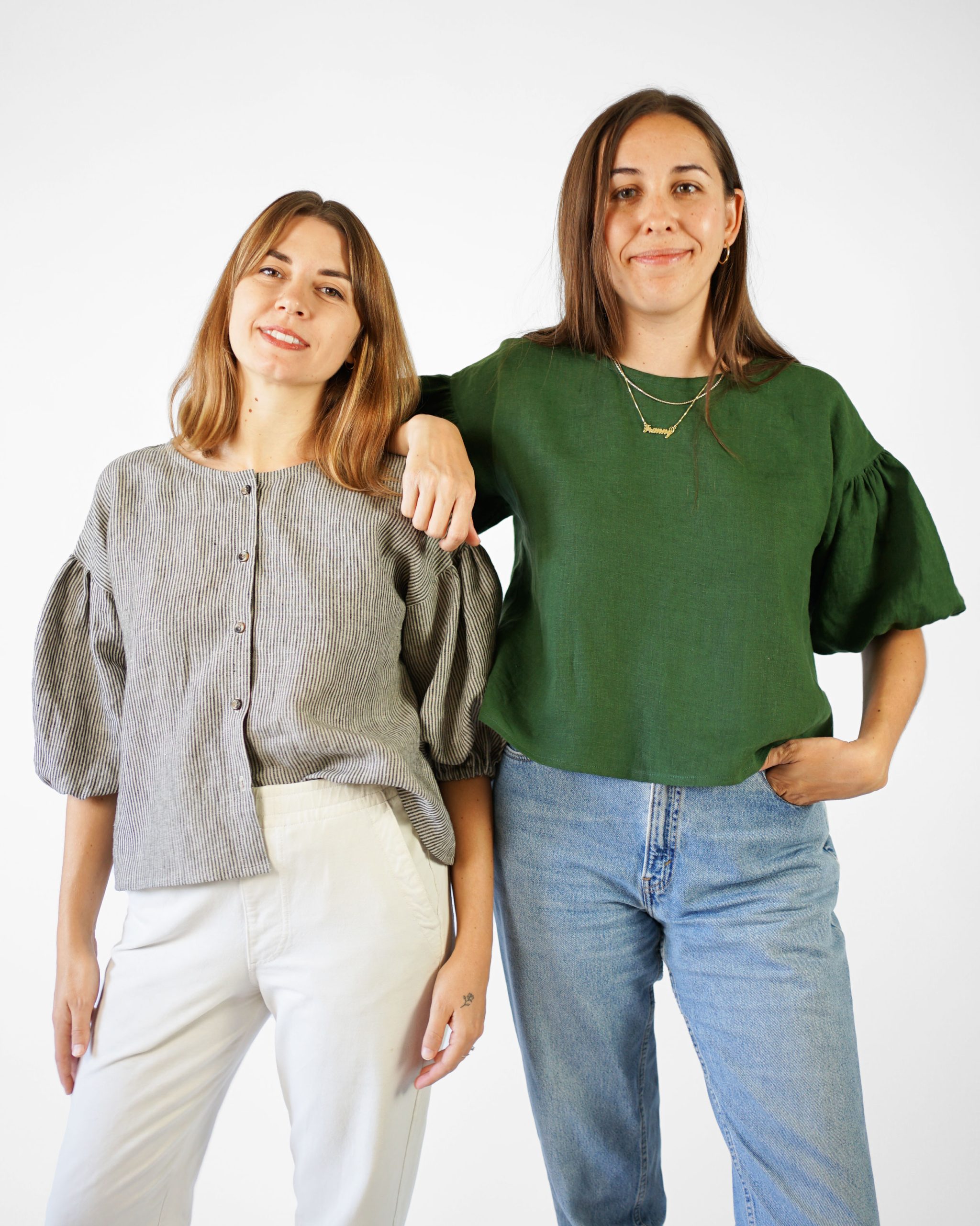 Women wearing the Perfect Puff Sleeve Top sewing pattern from Matchy Matchy on The Fold Line. A top pattern made in light to medium weight woven fabrics, featuring a relaxed A-line silhouette, wide round neckline, dropped shoulders, elbow length puff slee