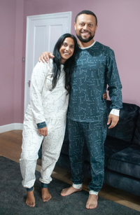 Man and Woman wearing the Men’s Pops Perri PJs sewing pattern from Pattern Paper Scissors on The Fold Line. A pyjamas pattern made in jersey or viscose jersey fabrics, featuring a round neck top with full length sleeve and cuff, trousers have full length 