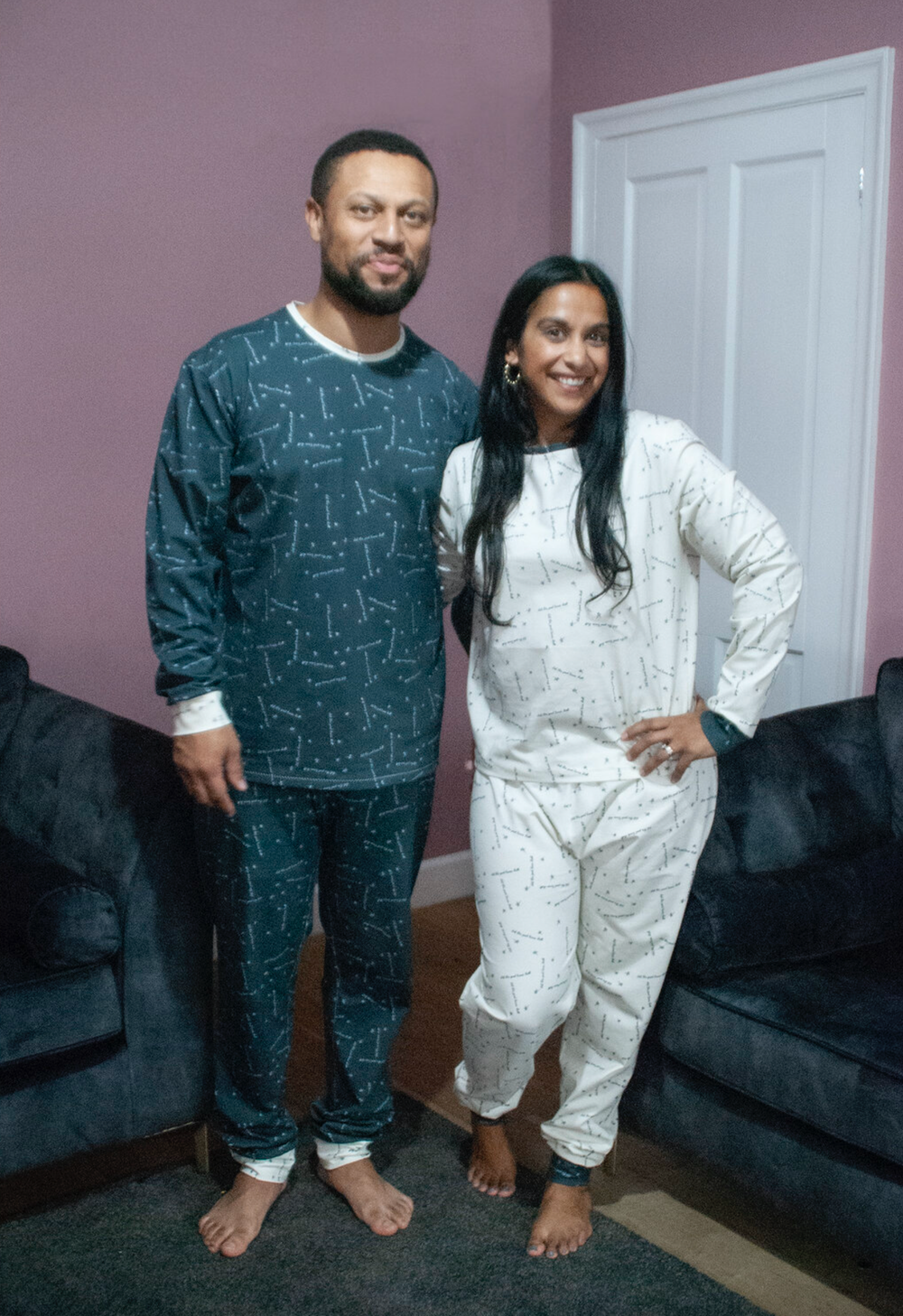 Man and Woman wearing the Women’s Moms Perri PJs sewing pattern from Pattern Paper Scissors on The Fold Line. A pyjamas pattern made in jersey or viscose jersey fabrics, featuring a round neck top with full length sleeve and cuff, trousers have full lengt