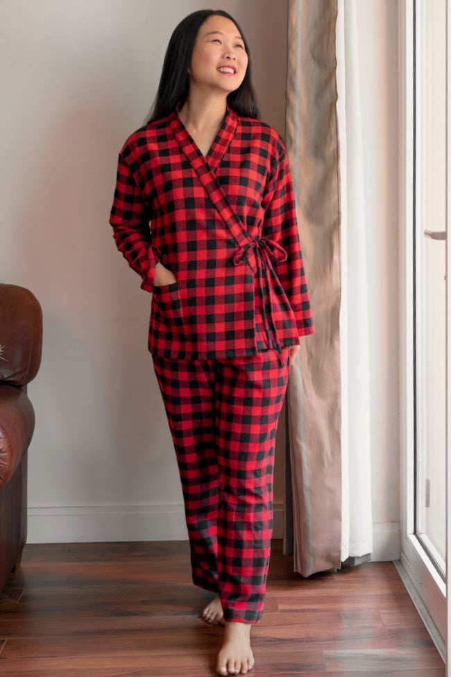 Woman wearing the Pine Cove Pajamas sewing pattern from Itch to Stitch on The Fold Line. A pyjamas pattern made in flannel, silk, satin, double gauze, broadcloth, chambray and cotton lawn fabrics, featuring a relaxed fit, hip-length top has dropped should