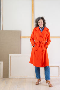 Woman wearing the Prado Trench Coat sewing pattern from Liesl + Co on The Fold Line. A trench coat pattern made in cotton twill, gabardine, canvas, linen, or sateen fabric, featuring a double-breasted front, princess seams, an attached cape with an invert