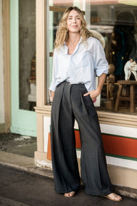 Woman wearing the Protea Pants sewing pattern from Paradise Patterns on The Fold Line. A trouser pattern made in rayon twill or crepe, Tencel/lyocell twill, linens, cotton, woollens, corduroy, denim, silk or satin fabrics, featuring a high waist, in-seam 