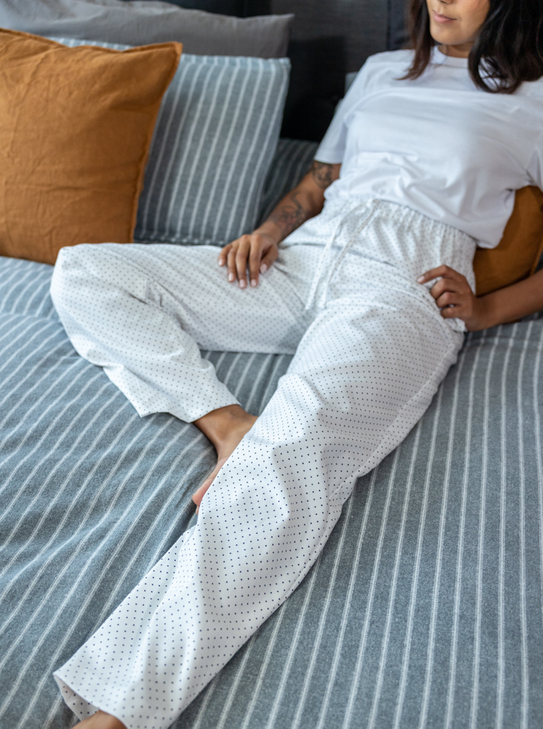 Women wearing The Pyjama Bottoms sewing pattern from The Avid Seamstress on The Fold Line. A PJ trouser pattern made in cotton lawn, flannel, brushed cotton or cotton fleece fabrics, featuring a relaxed fit, elasticated waistband, side seam pockets, and a