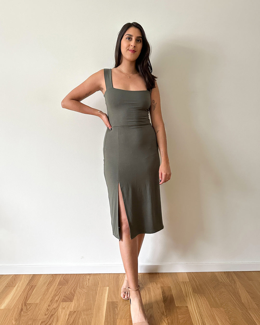 Woman wearing the Raveena Dress sewing pattern from Tammy Handmade on The Fold Line. A dress pattern made in viscose/jersey knits, stretch velvet or any stretchy fabric with at least 5% elastane/spandex content or at least 40% stretch, featuring a midi le