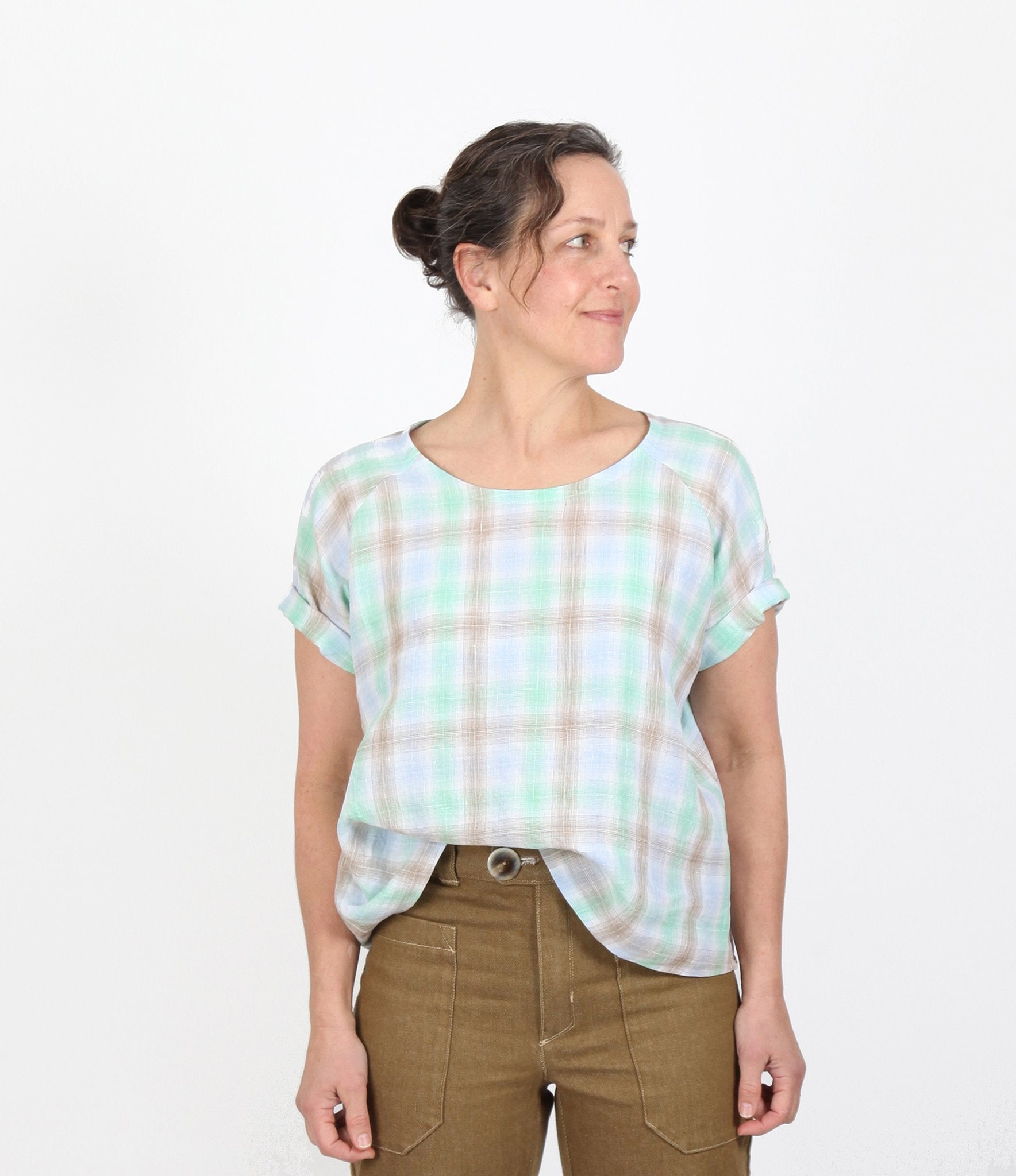 Woman wearing the Remy Raglan Top sewing pattern from Sew House Seven on The Fold Line. A top pattern made in linen, linen blends, cotton voile, silk noil, sand-washed silk or cotton gauze fabrics, featuring short raglan sleeves, relaxed boxy silhouette a