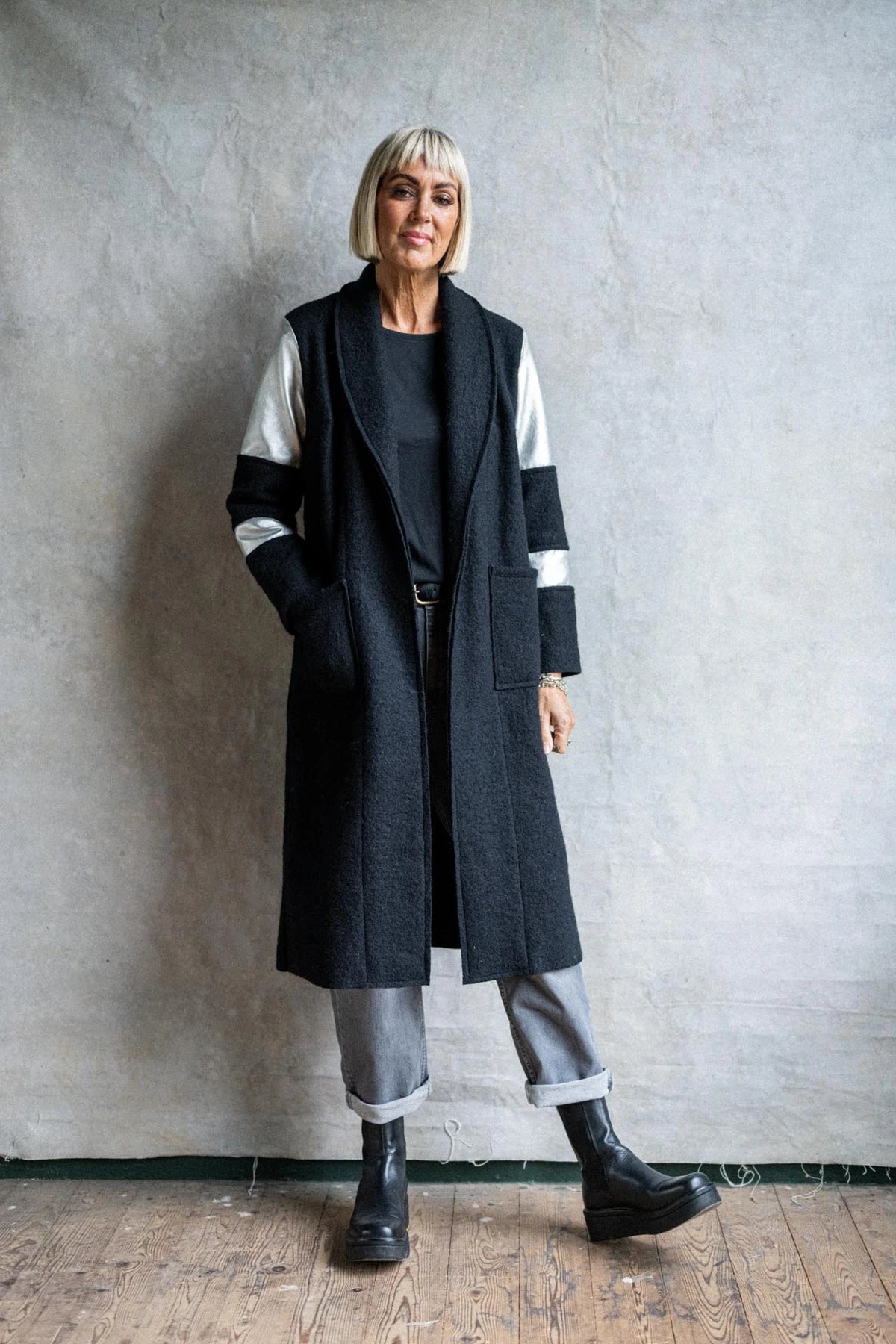 Women wearing the Rock Steady Coat sewing pattern from Sew La Di Da Vintage on The Fold Line. A coat pattern made in boiled wool fabrics, featuring patch pockets, below knee length, one banded full length and one plain sleeve, flat collar, V-neck, bust da