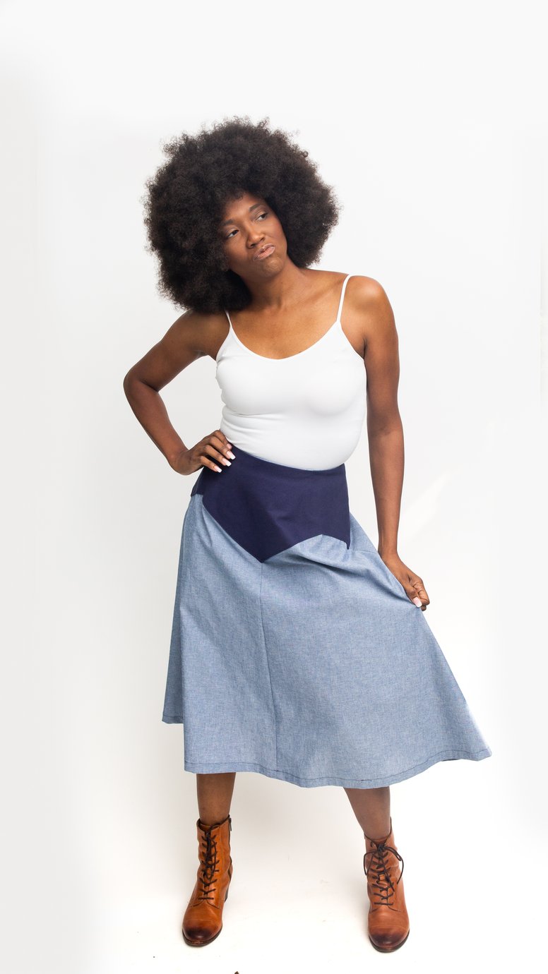 Woman wearing the 243 Rodeo Cowgirl Skirt sewing pattern from Folkwear on The Fold Line. A skirt pattern made in denim, cotton, linen, suede, leather, lace or silk fabrics, featuring a flared A-line silhouette, shaped waistline with front and back darts, 