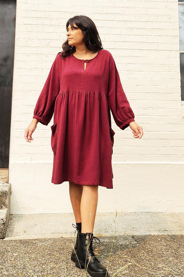 Woman wearing the Romey Gathered Dress sewing pattern from Sew House Seven on The Fold Line. A dress pattern made in linen/viscose blends, rayon challis, linen/rayon, sandwashed silk, linen or cotton lawn fabrics, featuring a scoop neckline with front but