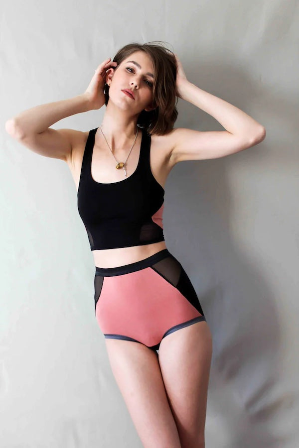 Woman wearing the Median Knickers sewing pattern from Sophie Hines on The Fold Line. A briefs pattern made in knit fabrics, featuring a high waist, full coverage, and fully lined wide crotch.