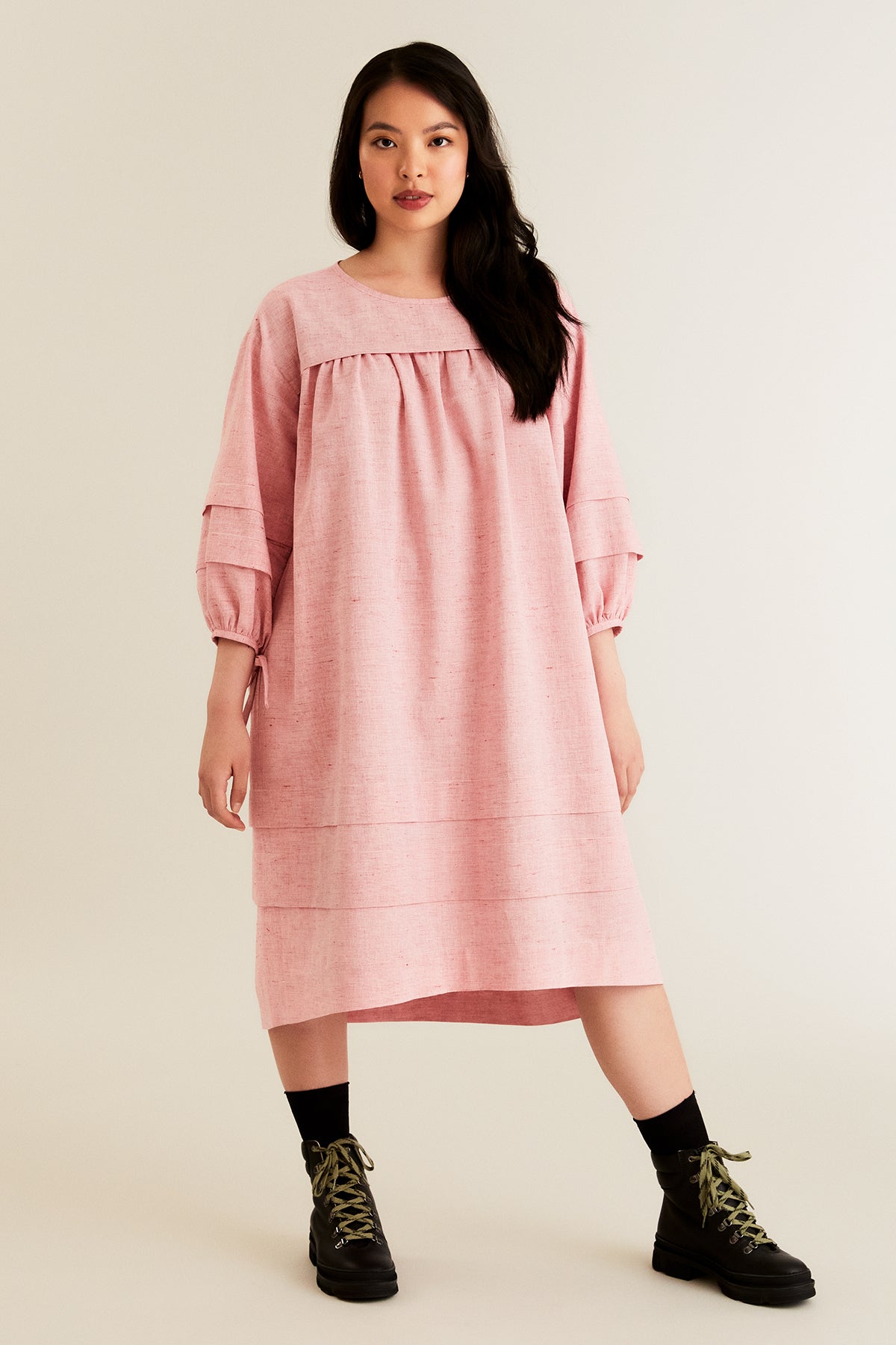 Women wearing the Syli Dress sewing pattern from Named on The Fold Line. A dress pattern made in cotton, linen, Tencel and rayon shirtings or dress-weight fabrics, featuring a loose fit, gathered bodice, shallow tuck across the chest, slightly dipping bac