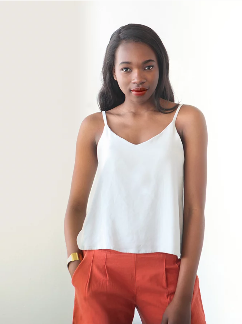 Woman wearing the Ogden Cami sewing pattern by True Bias. A camisole pattern made in crepe, rayon challis, voile or lightweight linen fabric featuring a soft V-neck at both centre front and centre back and delicate spaghetti straps.