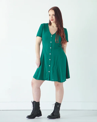 Woman wearing the Shelby Dress sewing pattern by True Bias. A dress pattern made in rayon challis, crepe, silk or linen fabric featuring princess seams, front button fastening, short sleeves and a V-shaped neckline.