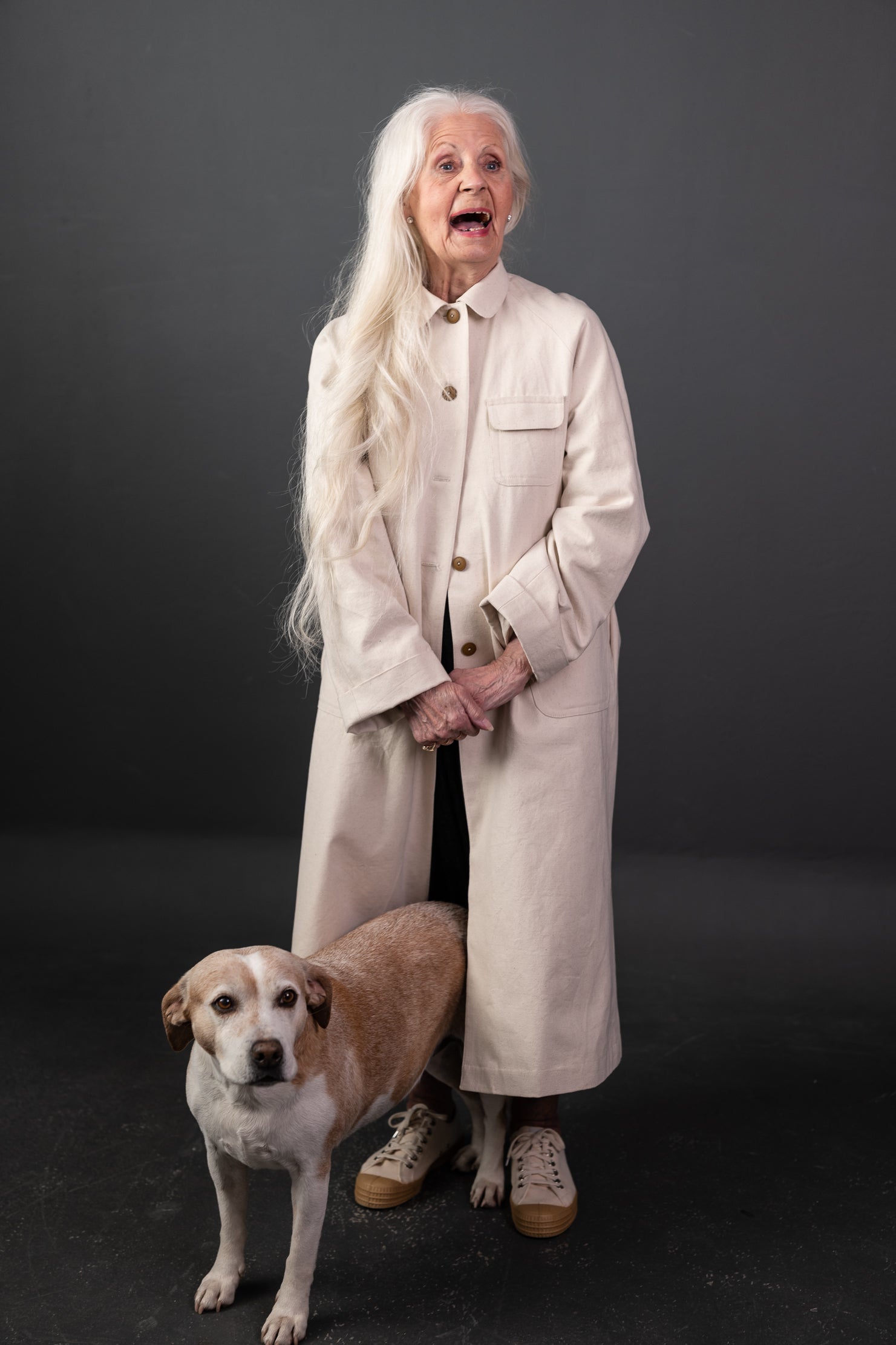 Woman wearing The September Coat sewing pattern from Merchant and Mills on The Fold Line. A duster coat pattern made in dry oilskin, oilskin, mid - heavyweight linens, denim, wool, corduroy, cotton twills or canvas fabric, featuring a relaxed fit, button 