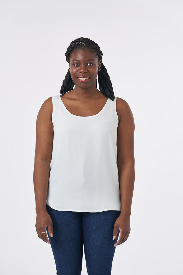 Woman wearing the Silk Cami sewing pattern from Sew Over It on The Fold Line. A camisole pattern made in rayon, viscose, crepe de chine or crepe fabrics, featuring French seams, broad shoulder straps, scoop neckline and sleeveless.