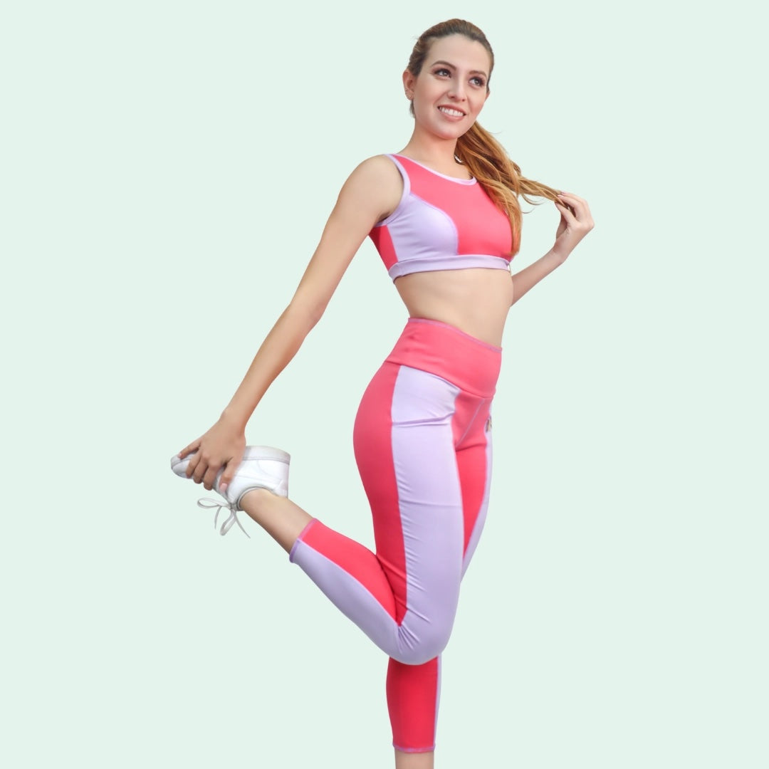 Woman wearing the Elizabeth Leggings sewing pattern from Sirena Patterns on The Fold Line. A leggings pattern made in nylon/spandex, activewear knits or jersey/spandex fabrics, featuring a cropped length, high waist, zippered pocket at the waist and side 