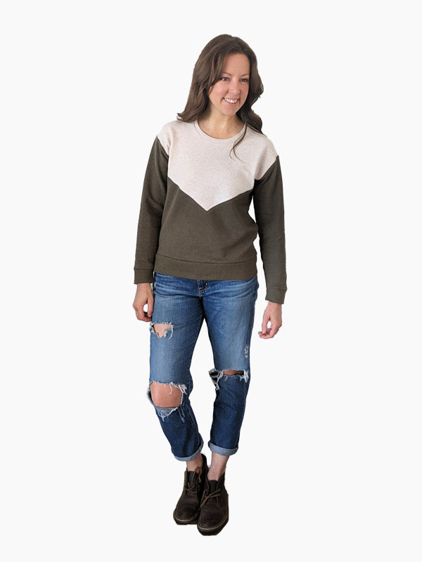 Woman wearing the Sitka Sweatshirt sewing pattern from Hey June Handmade on The Fold Line. A sweatshirt pattern made in sweatshirt fleece or French terry with spandex fabrics, featuring a cuffed sleeves and hem, crew neck, dropped shoulders, front and bac