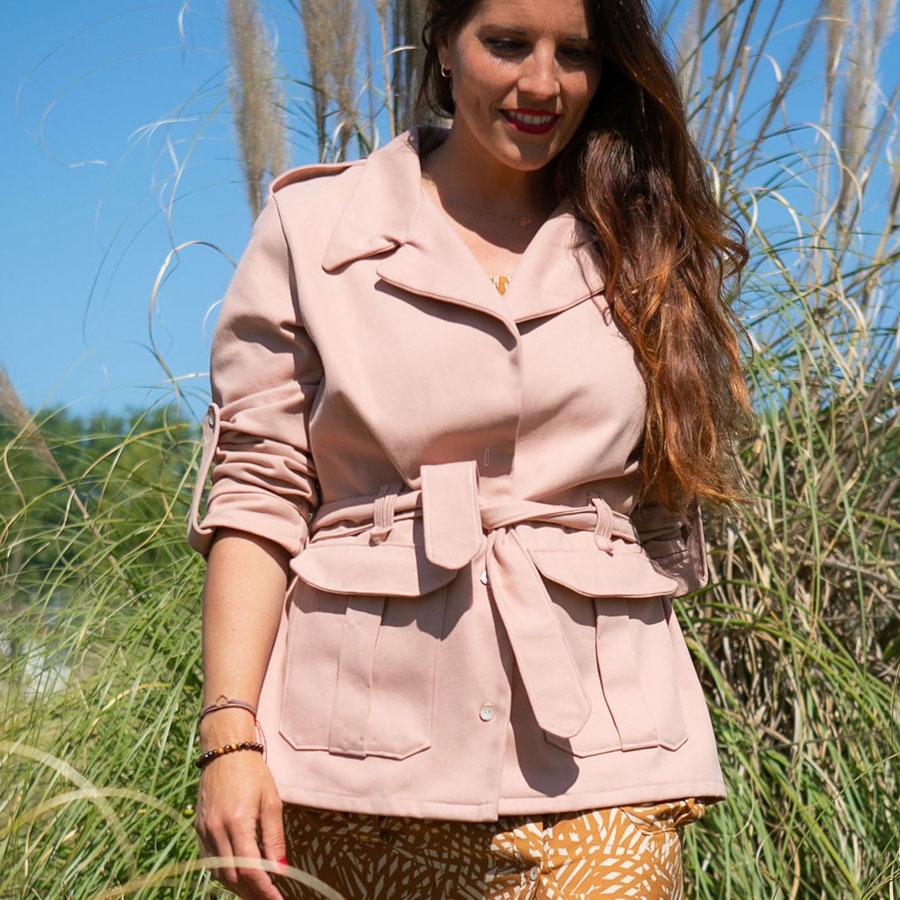 Woman wearing the Spring Safari Jacket sewing pattern from You Made My Day Patterns on The Fold Line. A jacket pattern made in gabardine, canvas, cotton or jacquard fabrics, featuring front button closure, collar, flapped patch pockets, button tabs on the