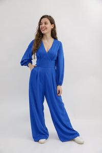 Women wearing the Springe Jumpsuit sewing pattern from Sew Love Patterns on The Fold Line. A sleeve extension pattern made in viscose, cupro, tencel, crepe or rayon fabrics, featuring two new sleeve versions, a full-length set-in bell sleeve that gathers 