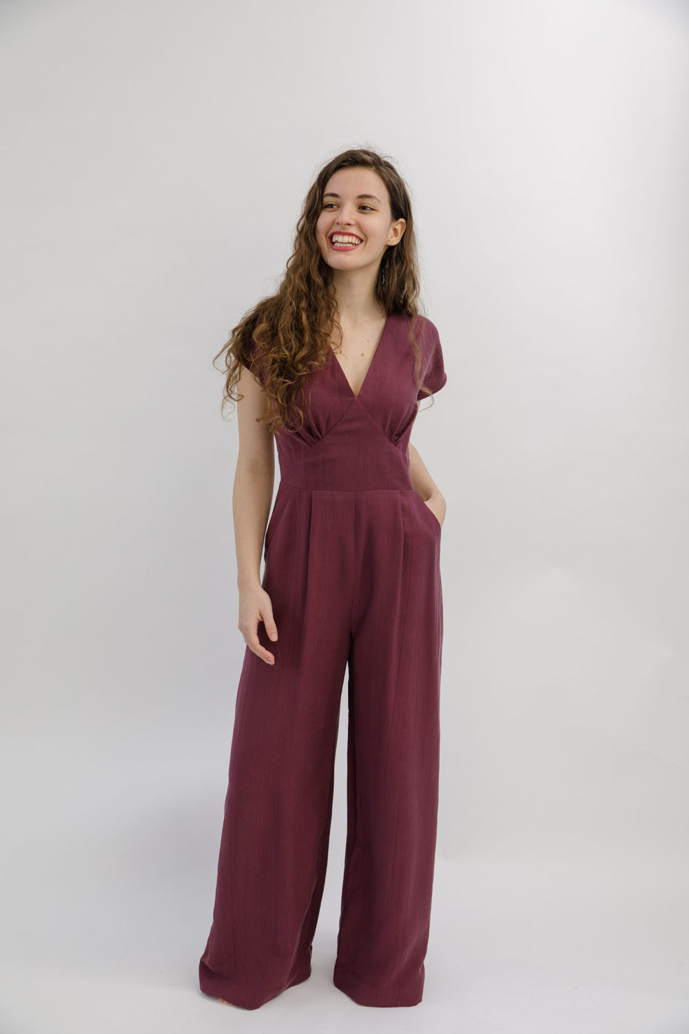 Women wearing the Springe Jumpsuit sewing pattern from Sew Love Patterns on The Fold Line. A jumpsuit pattern made in viscose, cupro, tencel, crepe or rayon fabrics, featuring a wide-leg, deep pockets, V-neck with gathering under the bust, curved waistban